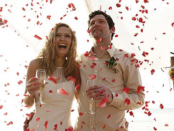 Mexico beach wedding toast with sparkling wine